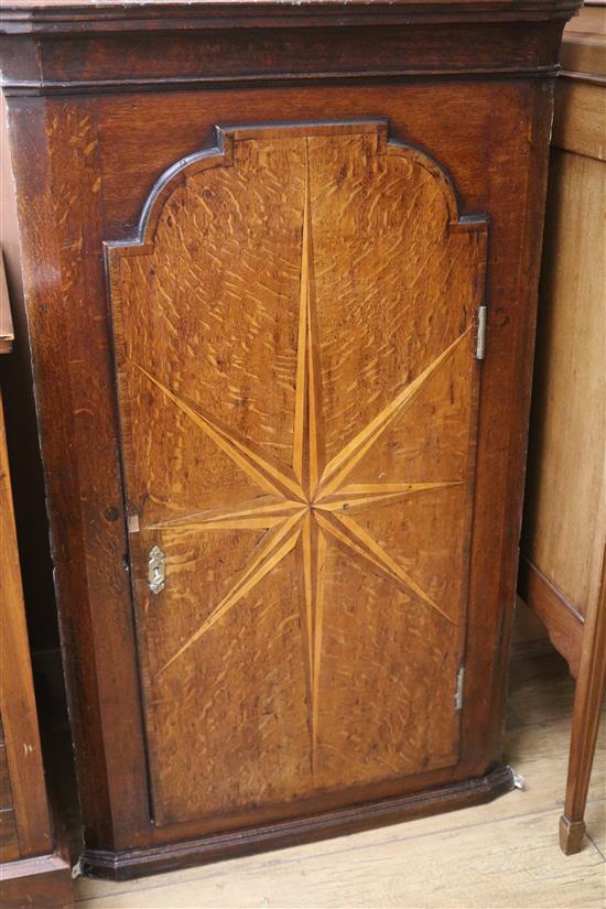 A George III oak corner cupboard, H.110cm